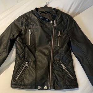 Material: Leather, Silver zippers, pockets, buttons and a zip up.
